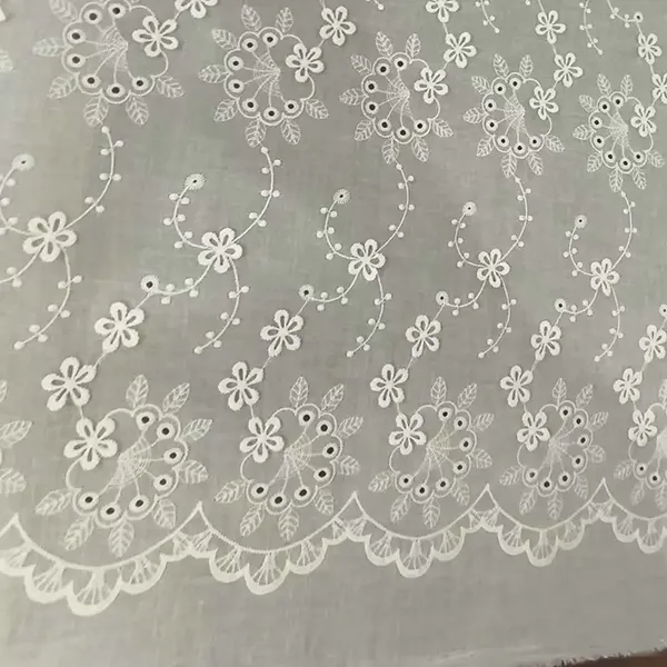 Tissu à œillets en dentelle à coton brodé